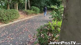 Masked Japanese babe pees after sensual pussy stimulation