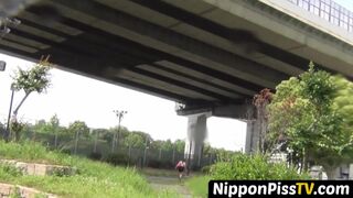 NipponPissTV.com - Debauched Asian schoolgirl pissing hard in public view on streets