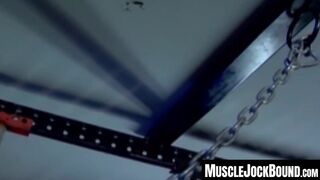 MuscleJockBound.com - Muscular man silenced with a ball gag while being heavily chain