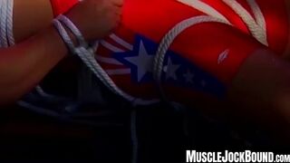 MuscleJockBound.com - Inked man in uniform struggles to free himself from tight ropes