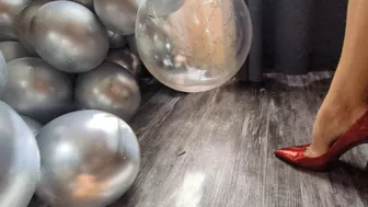 Clips 4 Sale - Katherine bursting balloons under her sexy red stilettos