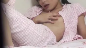 Horny Asian girl in bed fingering her hairless pussy in pajamas