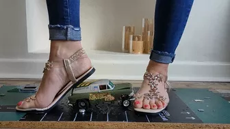 Clips 4 Sale - Priscilla toy car crush she crushes a 50s Chevy van & Ferrari in sandals close ground view