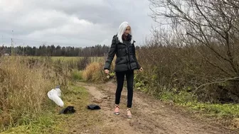 Clips 4 Sale - A girl in strappy shoes goes for a walk in rainy weather, there are puddles everywhere and mud that covers her shoes and feet