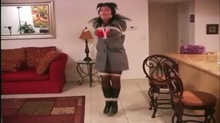 Gina Rae hops through out the house in a coat boots and gloves