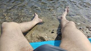 Sunbathing on the river bench, dipping my feet in the water