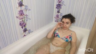 Clips 4 Sale - Hottie squishing her belly while lying in the bathtub
