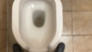Peeing in a public toilet with flabby balls