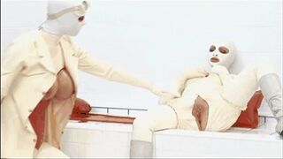 Clips 4 Sale - Two girls encased in white rubber catsuits - pussy fingered with latex gloves and warm piss emptied