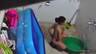Asian stepdaughter spied in the bathhouse