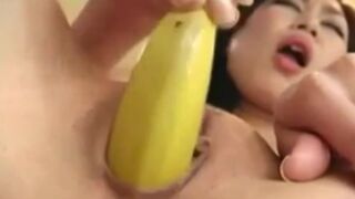 Asian Jariya shoves a banana deep in her tight pussy