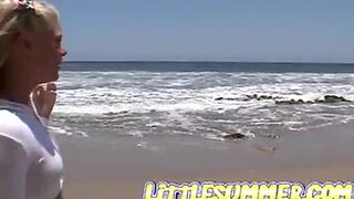 Petite teen lesbian fingered on the beach