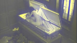 Slut fucks in massive coffin