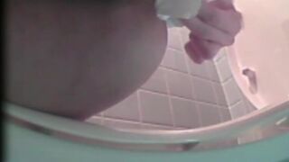 Youthful Japanese whores peeing in open latrine with spy cam