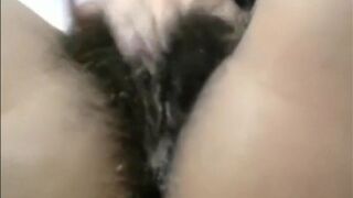 Arab mom Zina rubs extreme hairy cunt