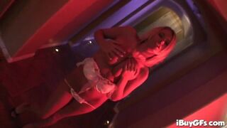 Blonde teens striptease in red lighting