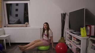 Girl plays balloons with pantyhose