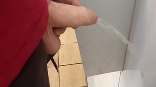 Hung lad at urinal next to me gets semi while pissing!
