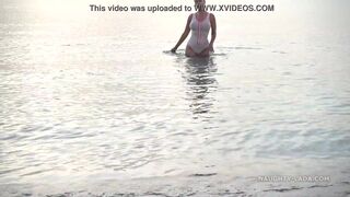 Wet transparent swimsuit in public