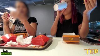 Two naughty girls making out with their breasts out while eating at McDonald's - Official Tattooed Angel