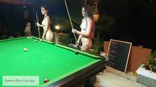 Two naked sluts play billiards in a night bar